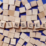 Cozy ASMR supplies setup with microphone, wooden tea set, keyboard and massager for relaxation