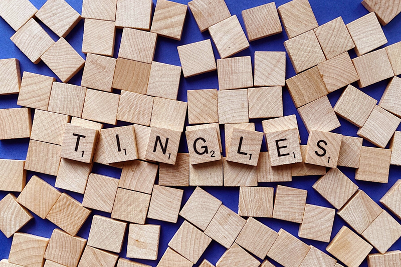 Cozy ASMR supplies setup with microphone, wooden tea set, keyboard and massager for relaxation