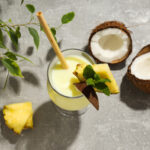 Fresh mango, pineapple, banana and passion fruit on a wooden board