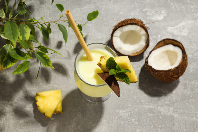 Fresh mango, pineapple, banana and passion fruit on a wooden board