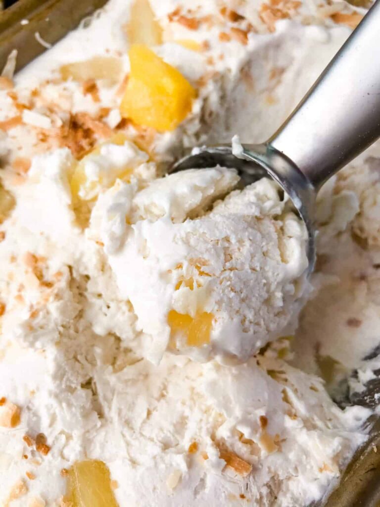 No-churn pina colada ice cream with toasted coconut and pineapple chunks