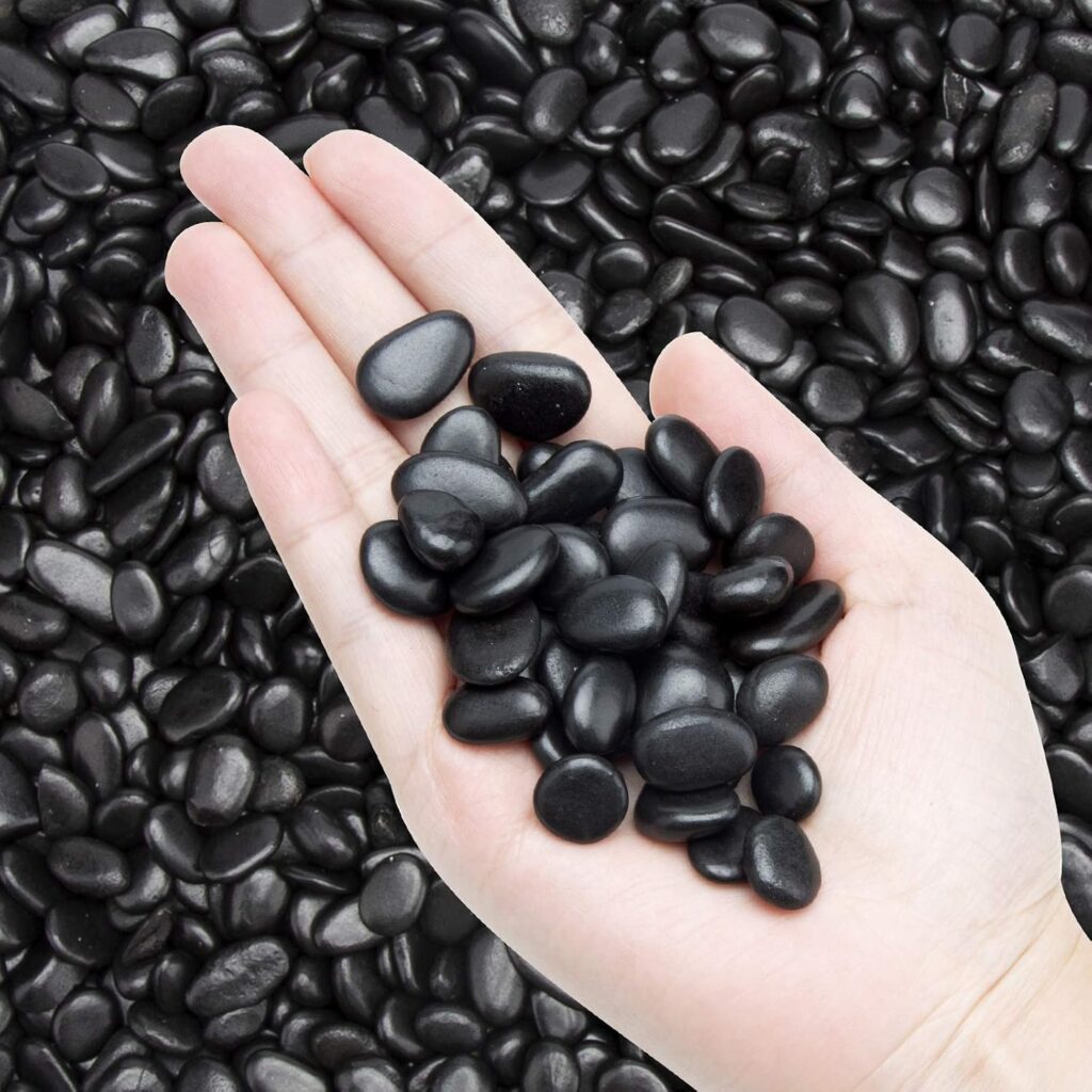 	Black small polished pebbles for indoor under-stair garden decor