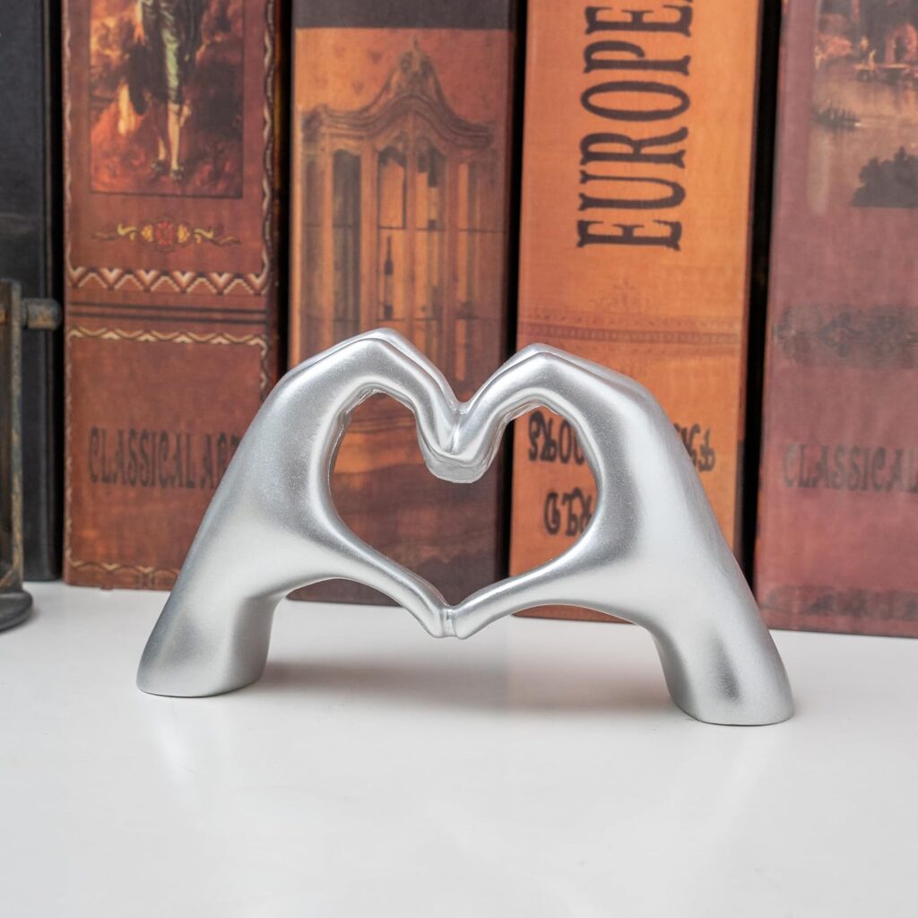 Small heart hands sculpture in silver modern love finger statue for shelf or coffee table