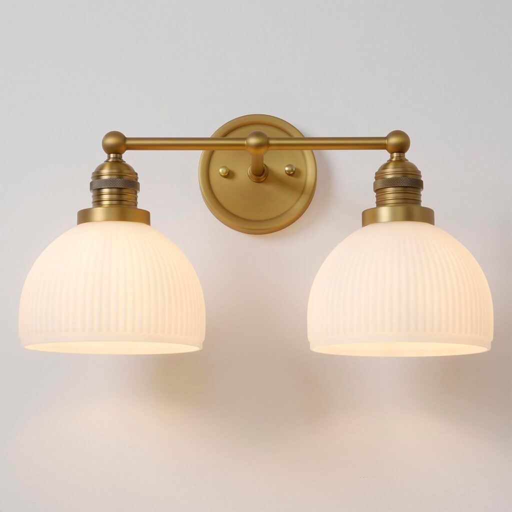 2-light gold wall sconces with hand-blown milk frosted glass for warm bathroom lighting