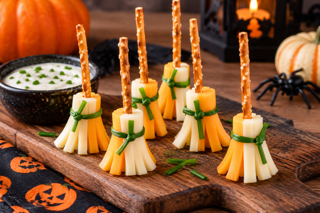 Halloween cheese and pretzel broomsticks tied with chives
